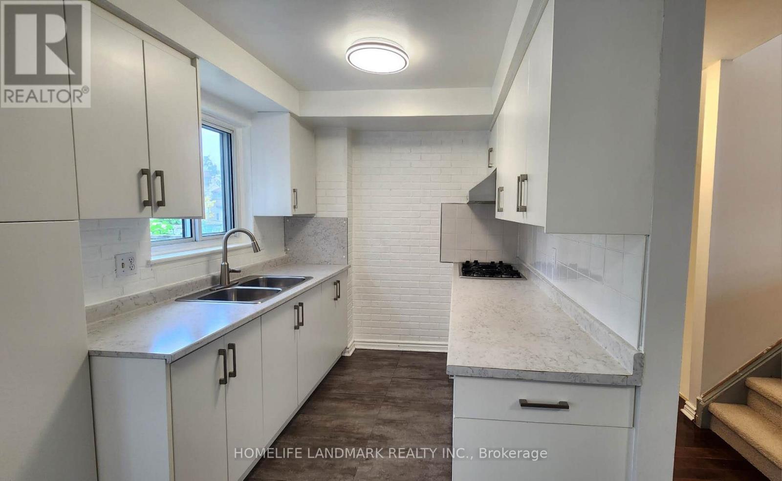 6 - 44 Chester Le Boulevard, Toronto, ON - Indoor Photo Showing Kitchen With Double Sink
