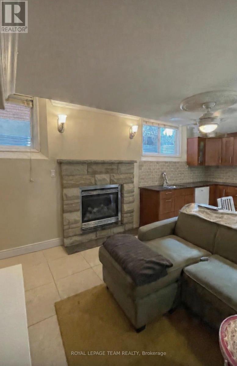 Gas fireplace - B - 526 Hilson Avenue, Ottawa, ON - Indoor Photo Showing Other Room With Fireplace