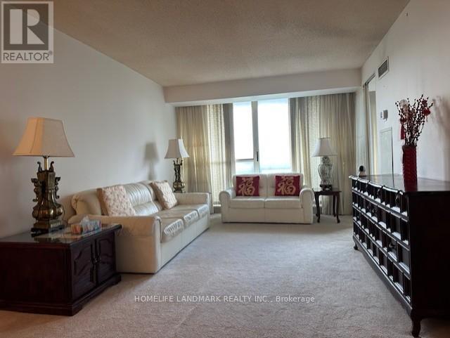 711 - 225 Bamburgh Circle, Toronto, ON - Indoor Photo Showing Living Room