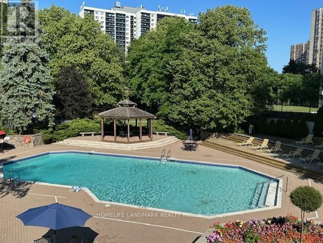 711 - 225 Bamburgh Circle, Toronto, ON - Outdoor With In Ground Pool With Backyard