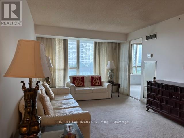 711 - 225 Bamburgh Circle, Toronto, ON - Indoor Photo Showing Living Room