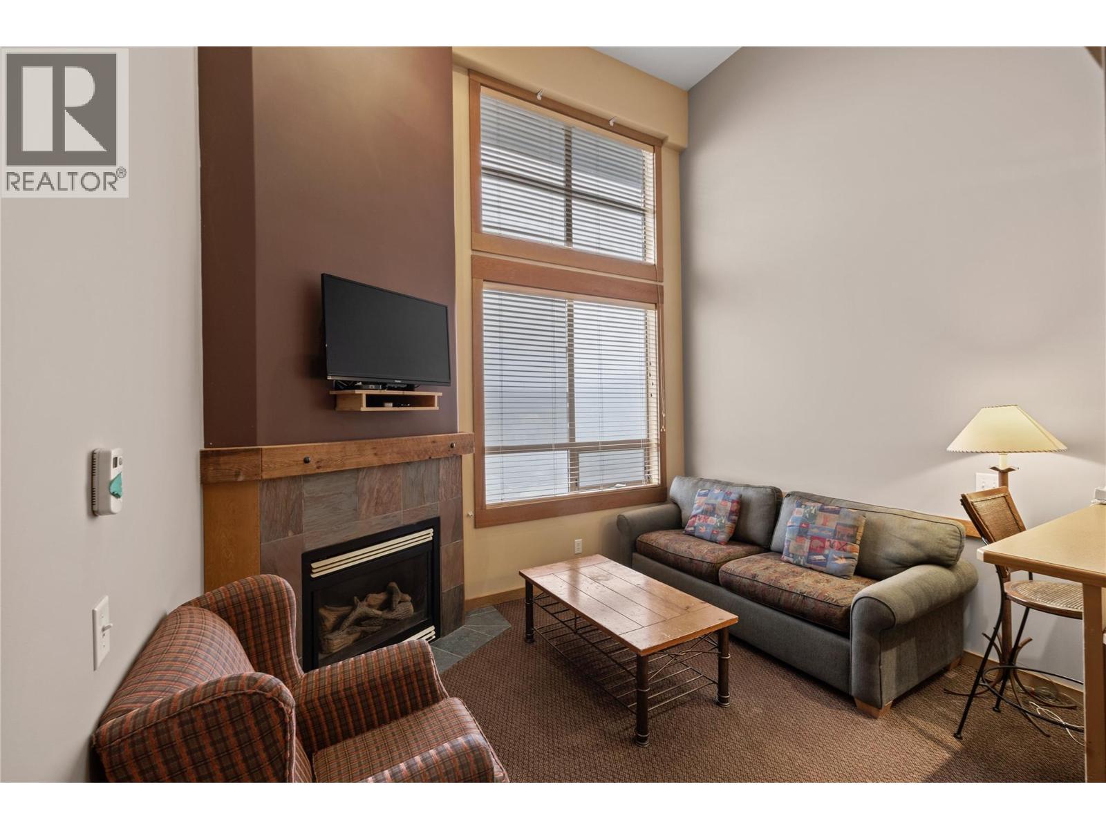 5335 Big White Road Unit# 220, Big White, BC - Indoor Photo Showing Living Room With Fireplace