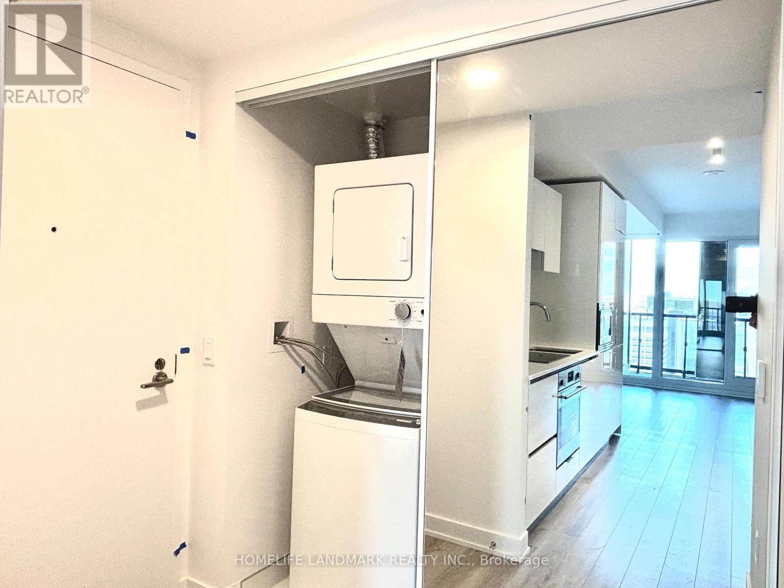 3101 - 238 Simcoe Street, Toronto, ON - Indoor Photo Showing Laundry Room