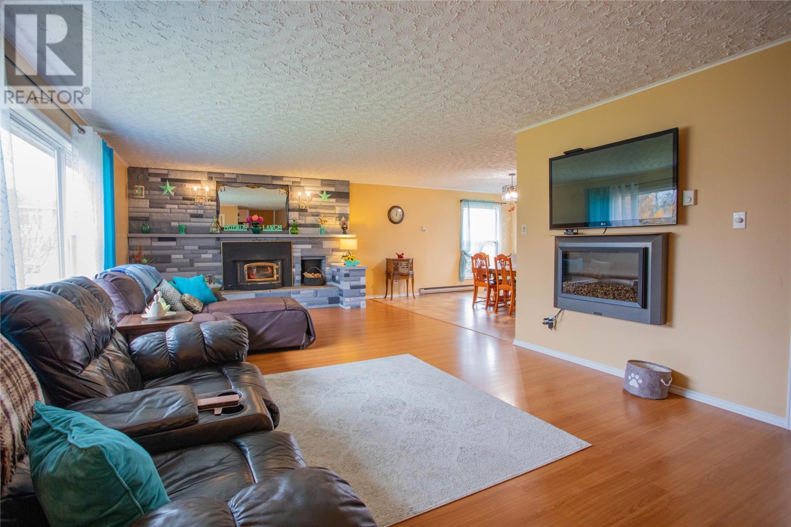 9-11 Pondside Road, Spaniards Bay, NL - Indoor Photo Showing Living Room With Fireplace