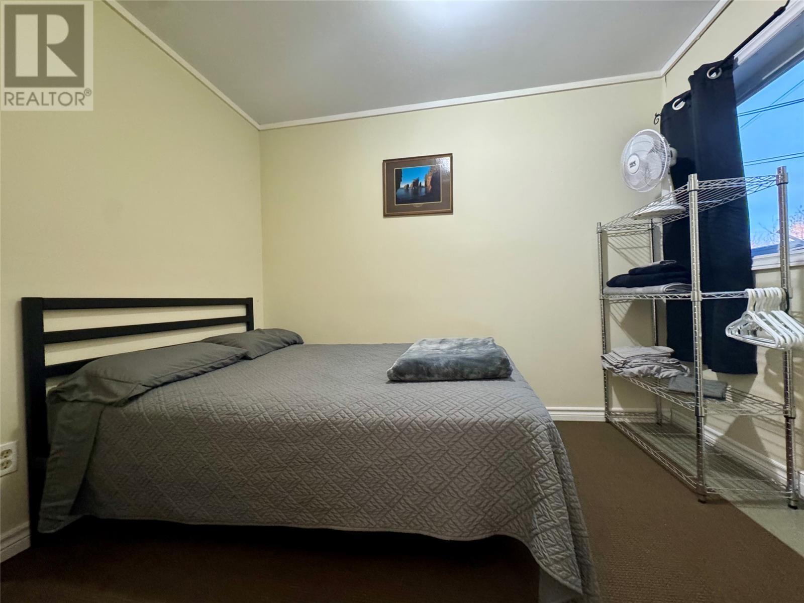 201-211 Main Street, Come By Chance, NL - Indoor Photo Showing Bedroom
