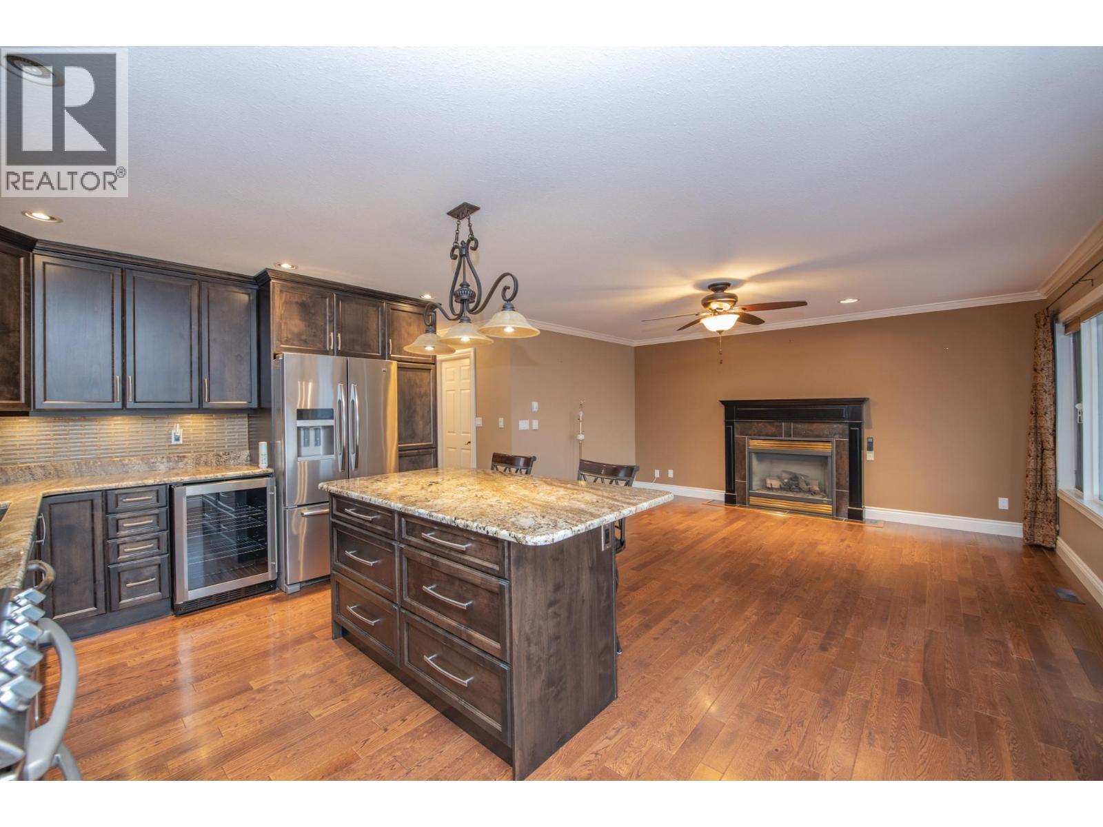 7903 Lakeview Drive, Coldstream, BC - Indoor Photo Showing Kitchen With Fireplace With Upgraded Kitchen