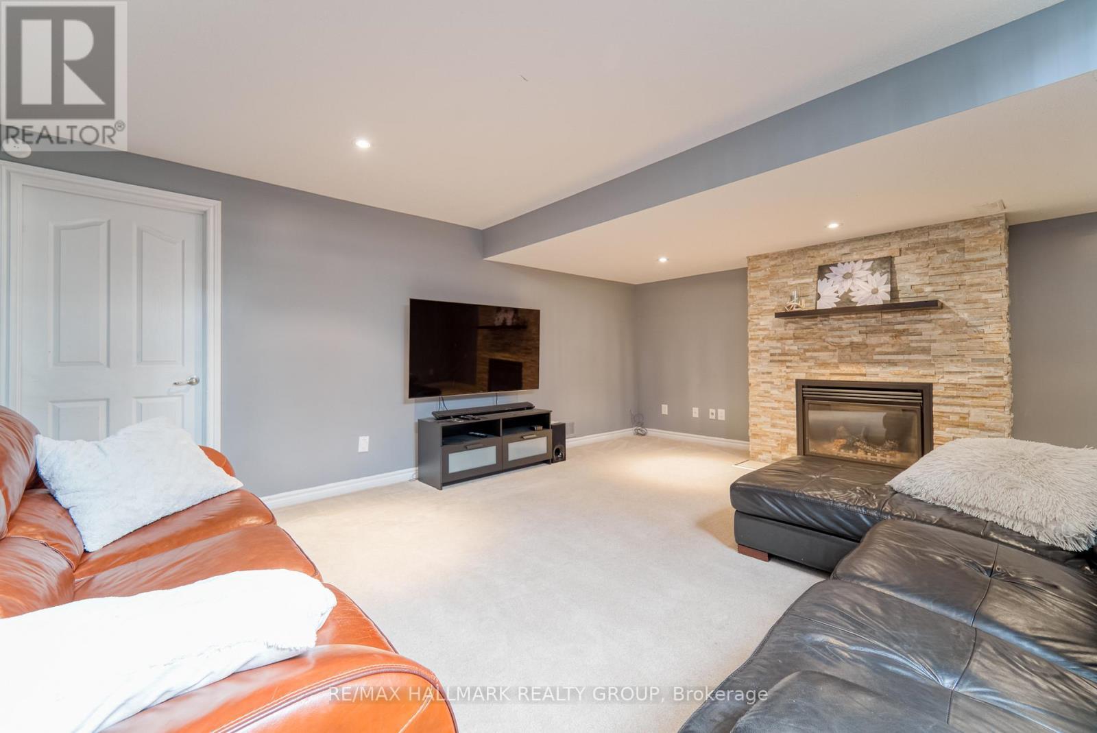 228 Eye Bright Crescent, Ottawa, ON - Indoor Photo Showing Living Room With Fireplace