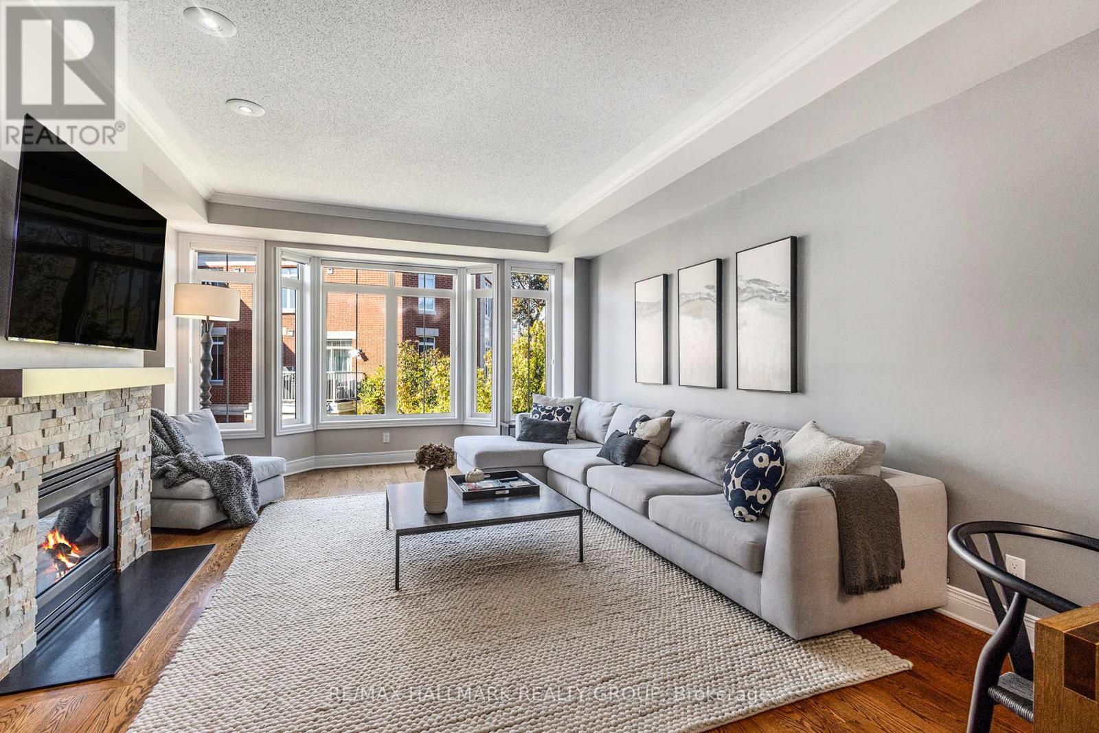 56 Kings Landing Private, Ottawa, ON - Indoor Photo Showing Living Room With Fireplace