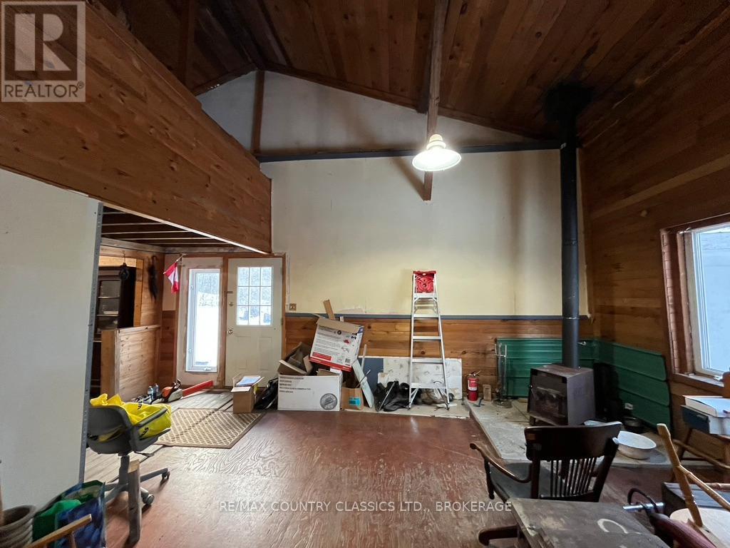 Main level - living room with cathedral ceiling - 534 B Slate Falls Road, Addington Highlands (Addington Highlands), ON - Indoor With Fireplace
