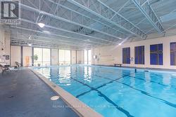 Bright indoor pool for residents. -