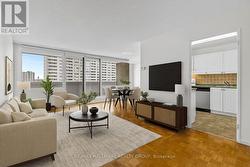 Staged view showcasing spacious living & dining -