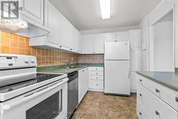 Additional kitchen angle showing appliances -