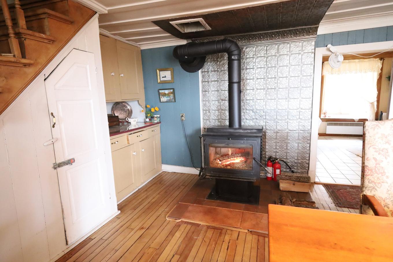 Dining room - 46 Route 132 E., Saint-Denis-De La Bouteillerie, QC - Indoor With Fireplace