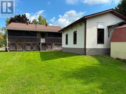 BACK VIEW OF HOUSE AND GARAGE -