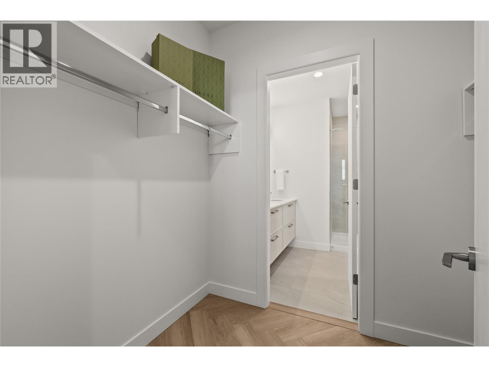 First Bedroom Walk-Through closet - 3340 Lakeshore Road Unit# 902, Kelowna, BC - Indoor With Storage