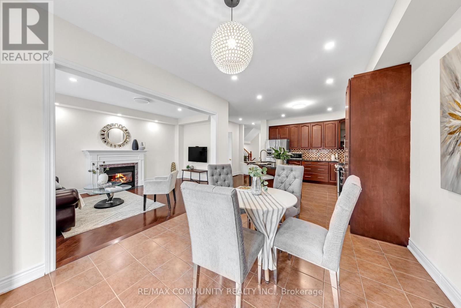 17 Rouge Bank Drive, Markham, ON - Indoor Photo Showing Dining Room With Fireplace