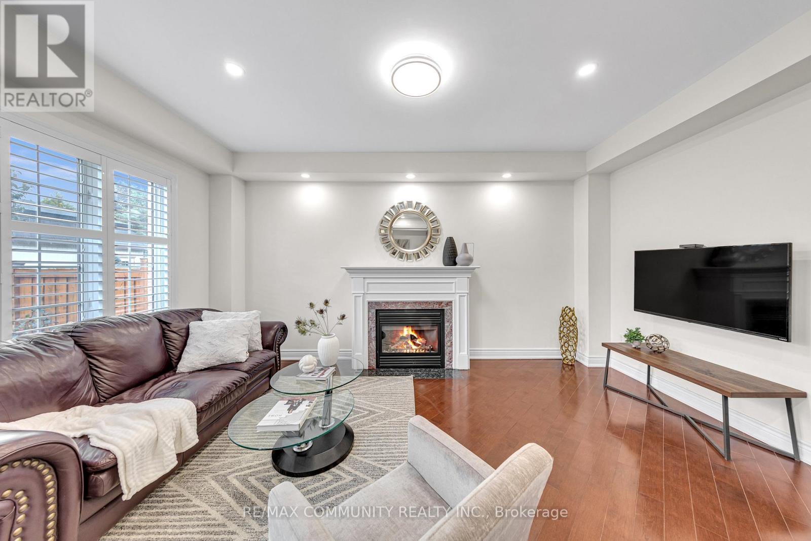 17 Rouge Bank Drive, Markham, ON - Indoor Photo Showing Living Room With Fireplace