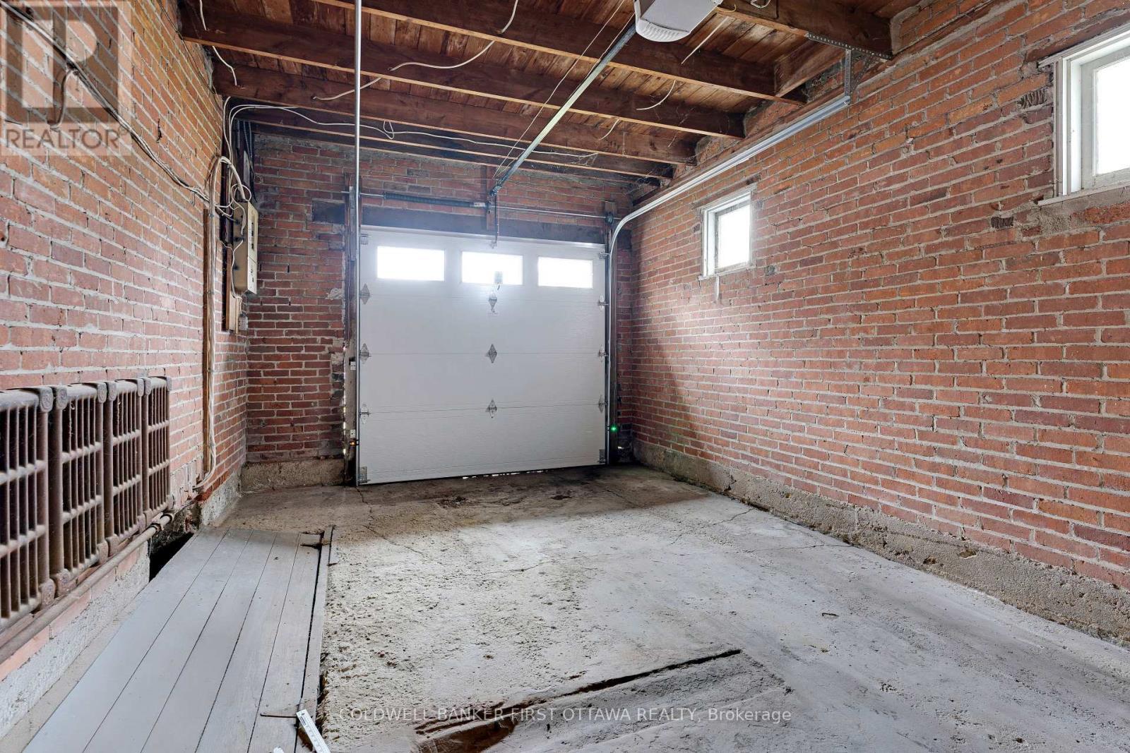 One car garage with kitchen & basement access - 2 Gladstone Avenue, Smiths Falls, ON - Indoor Photo Showing Garage