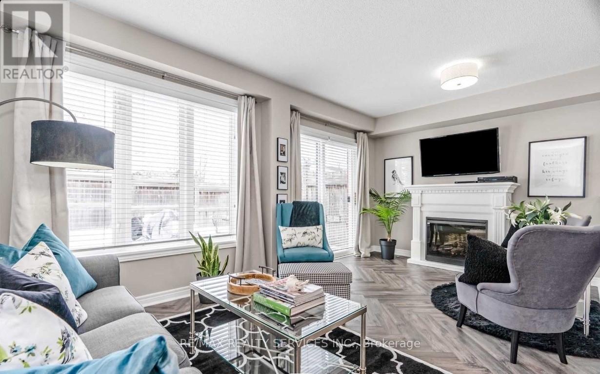 10 - 430 Mapleview Drive E, Barrie, ON - Indoor Photo Showing Living Room With Fireplace