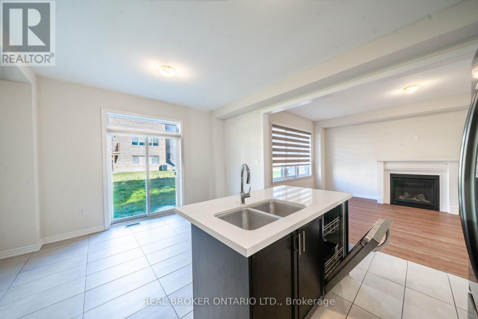 6 Northrop Avenue N, Clarington, ON - Indoor Photo Showing Kitchen With Fireplace With Double Sink