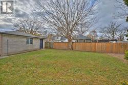 Backyard beside the garage -