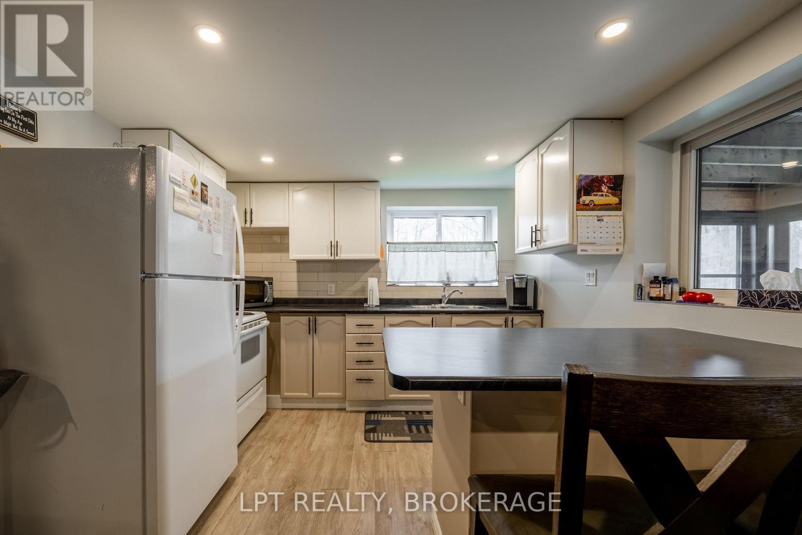 Lower Unit - 1857 Crow Lake Road, Frontenac (Frontenac Centre), ON - Indoor Photo Showing Kitchen With Double Sink