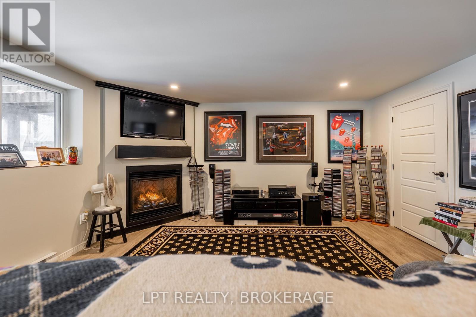 Lower Unit - 1857 Crow Lake Road, Frontenac (Frontenac Centre), ON - Indoor Photo Showing Living Room With Fireplace