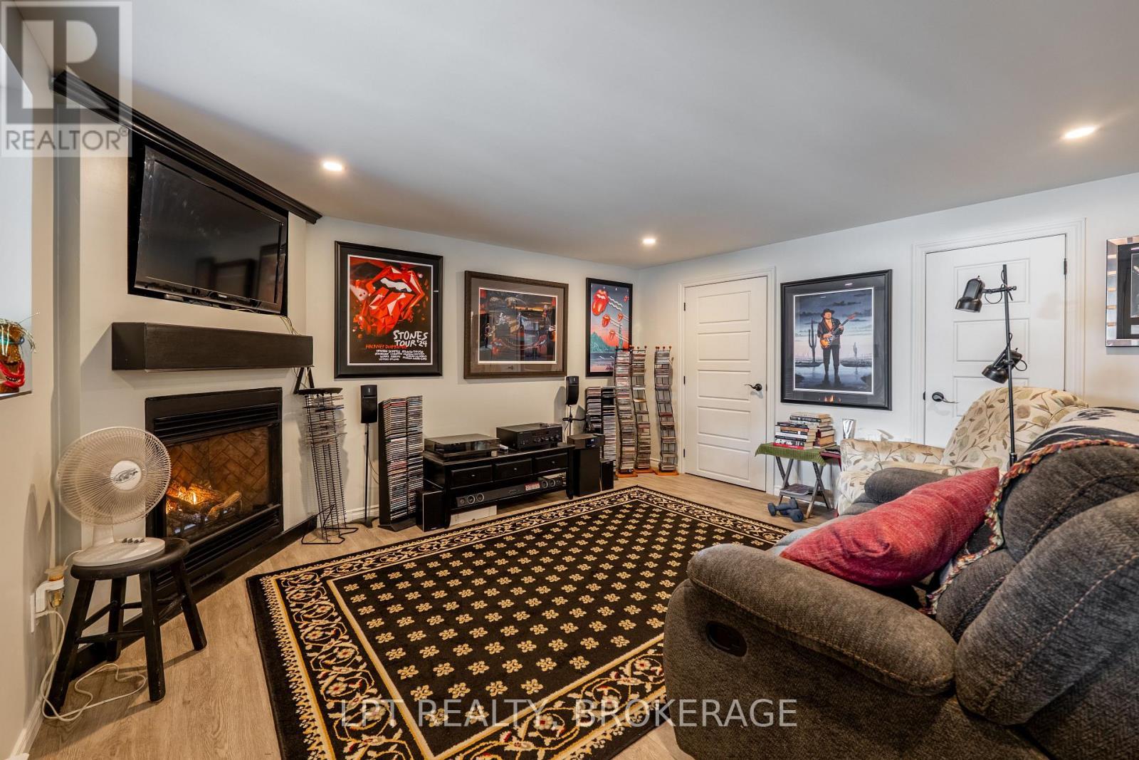 Lower Unit - 1857 Crow Lake Road, Frontenac (Frontenac Centre), ON - Indoor Photo Showing Living Room With Fireplace