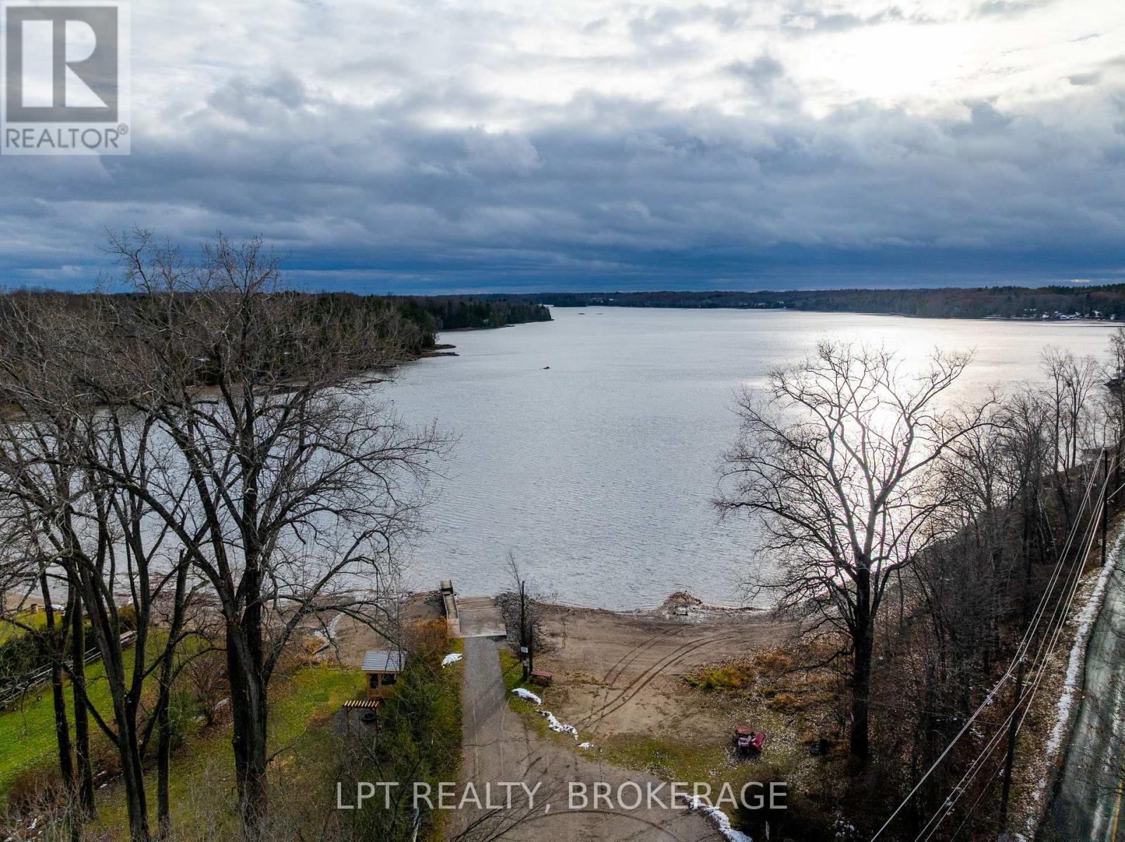 2 Minute Walk to Beach and Boat Launch - 1857 Crow Lake Road, Frontenac (Frontenac Centre), ON - Outdoor With Body Of Water With View