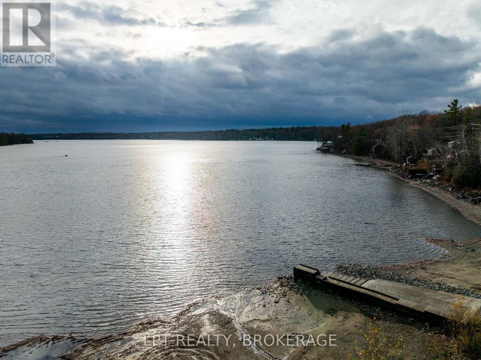 2 Minute Walk to Beach and Boat Launch - 1857 Crow Lake Road, Frontenac (Frontenac Centre), ON - Outdoor With Body Of Water With View