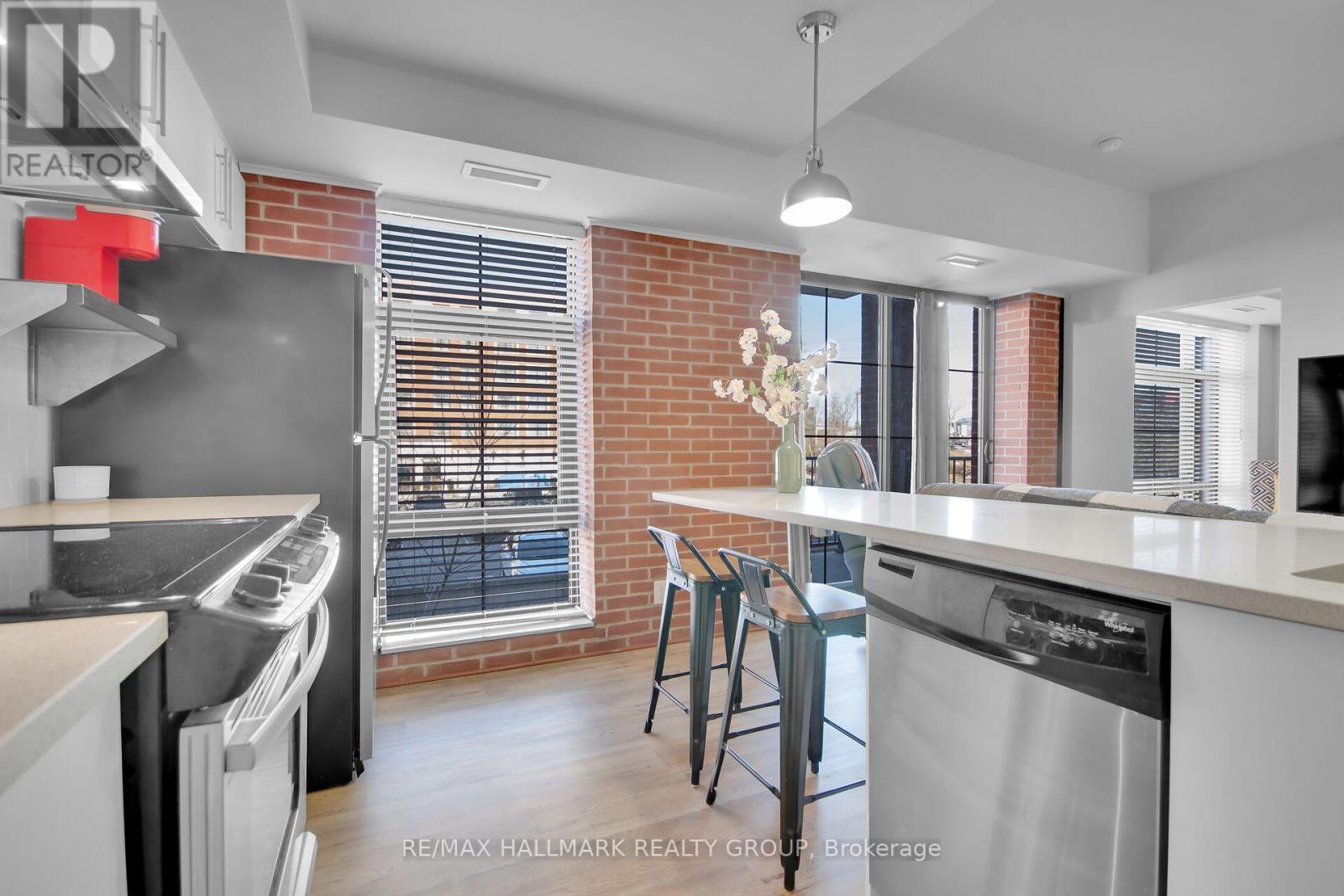 Workstation/island with seating - 208 - 555 Anand Private, Ottawa, ON - Indoor Photo Showing Kitchen