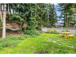 Sloped yard with mature trees & privacy. -