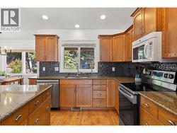 Kitchen - equipped with stainless steel appliances. -