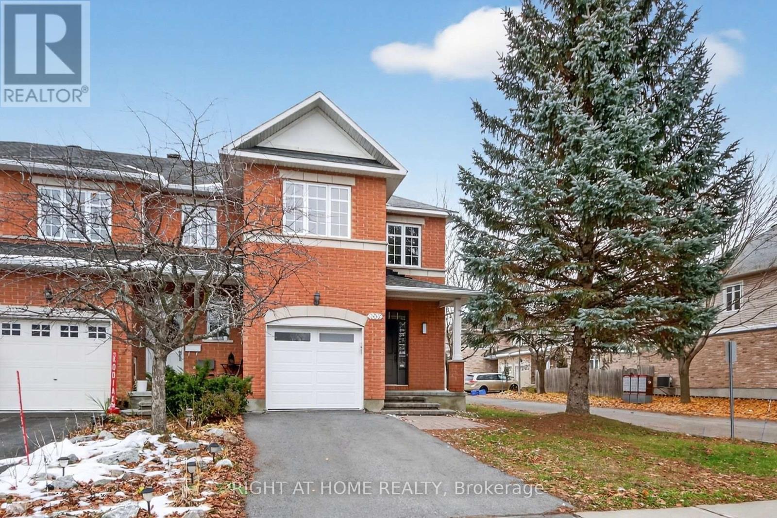 End Unit with Private Driveway - 302 Goldridge Drive, Ottawa, ON - Outdoor With Facade