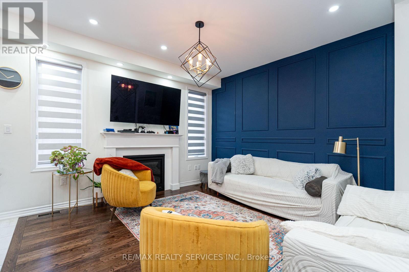 11 Cyclone Trail, Brampton, ON - Indoor Photo Showing Living Room With Fireplace