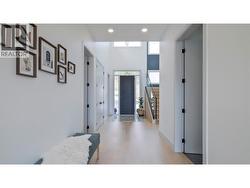 Foyer & hallway leading to main floor living area and kitchen -