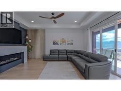 Living room w/access to deck overlooking vineyards and Lake Okanagan -