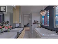 Double sinks, oversized windows with incredible views of Lake Okanagan -