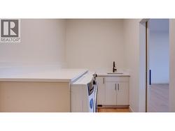 ENTERING MUD ROOM FROM GARAGE INTO THE KITCHEN. -