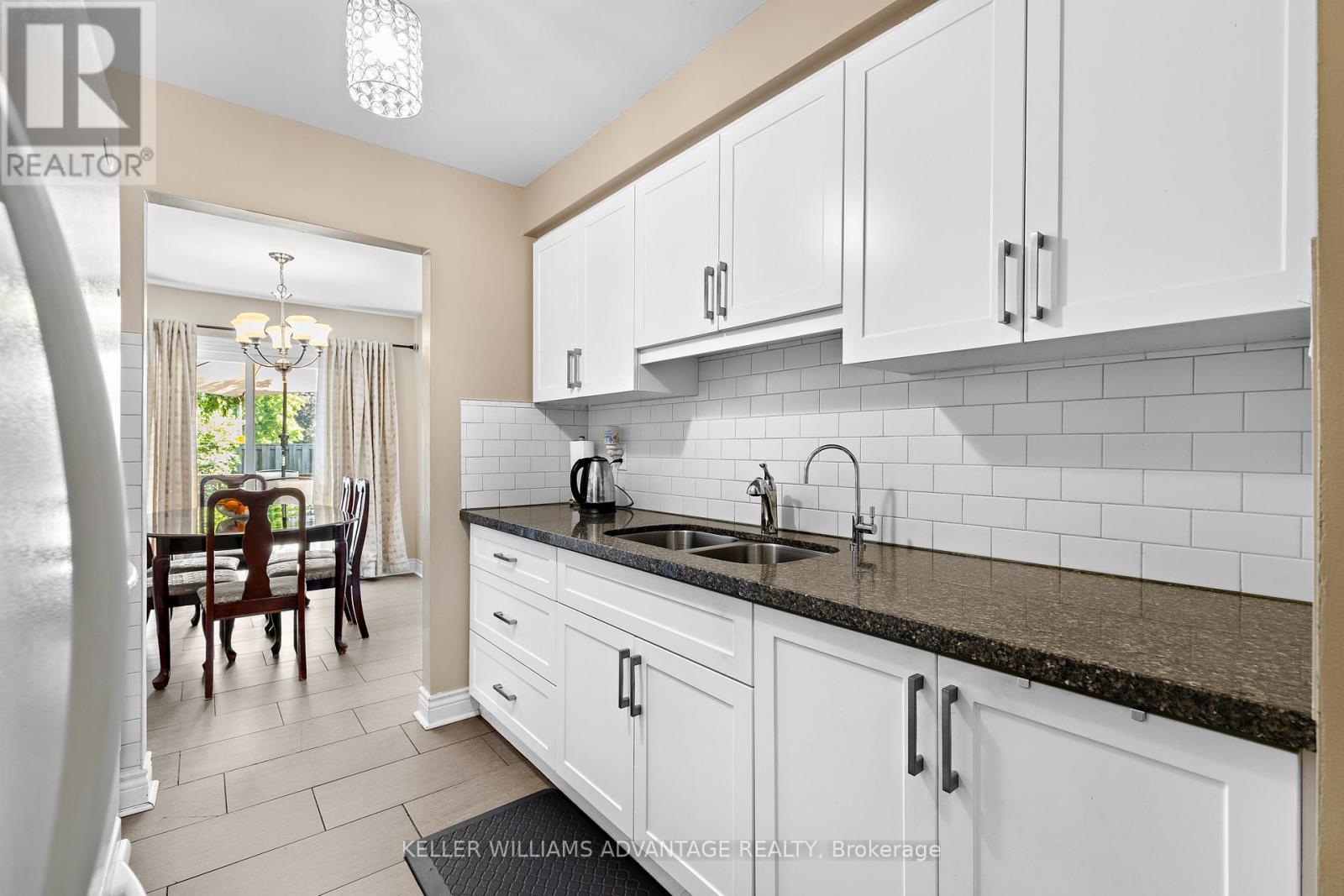 17 - 1051 Sandhurst Circle, Toronto, ON - Indoor Photo Showing Kitchen With Double Sink