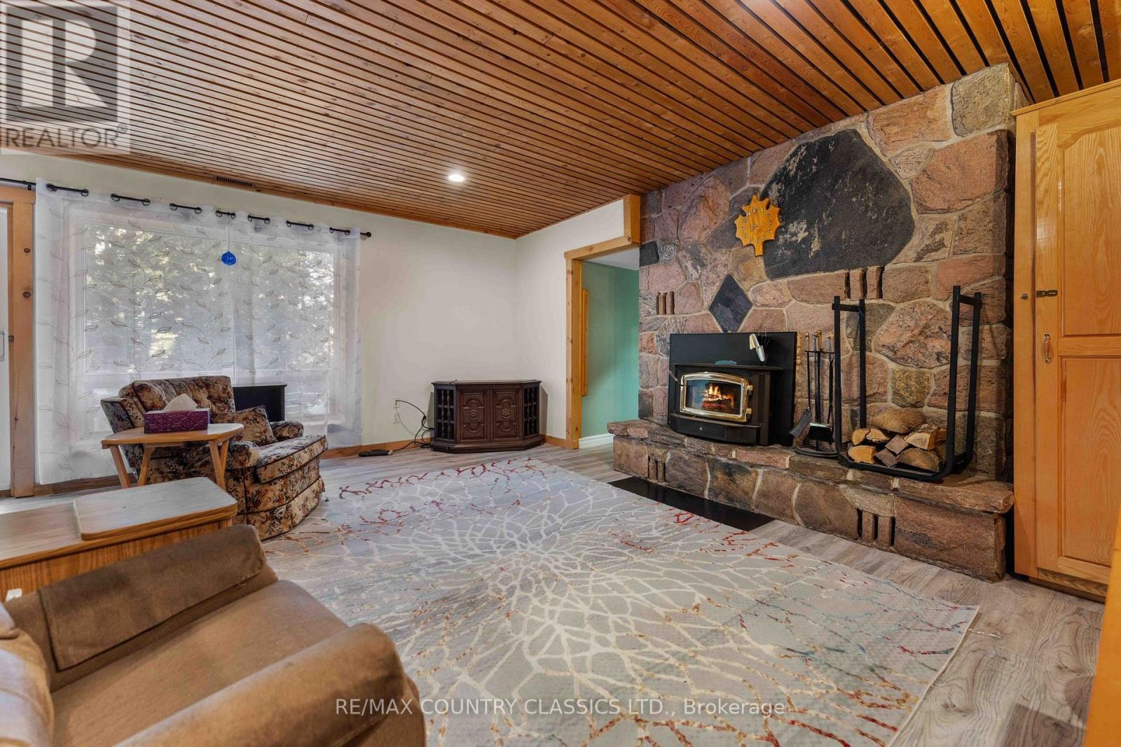 13 Lorbetskie Road, Madawaska Valley, ON - Indoor Photo Showing Other Room With Fireplace