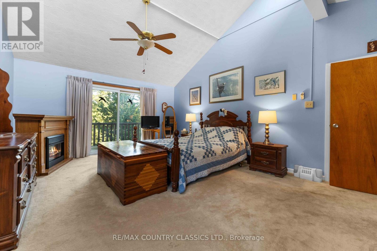 13 Lorbetskie Road, Madawaska Valley, ON - Indoor Photo Showing Bedroom With Fireplace
