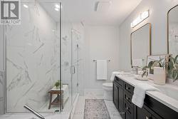 Ensuite bathroom with jetted tub, glass shower -