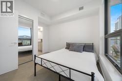 With a full sized sliding glass closet for clothing -