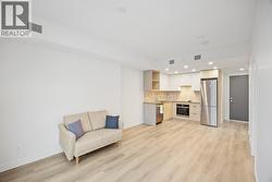 Between the couch & kitchen is a space designed for an at home office set up to take advantage of natural light -