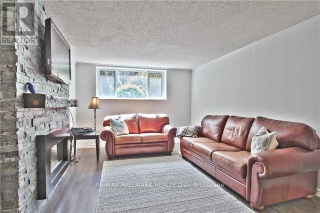 208 Pine Cove Road, Burlington, ON - Indoor Photo Showing Living Room With Fireplace
