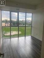 Unfurnished sunroom with a city view -