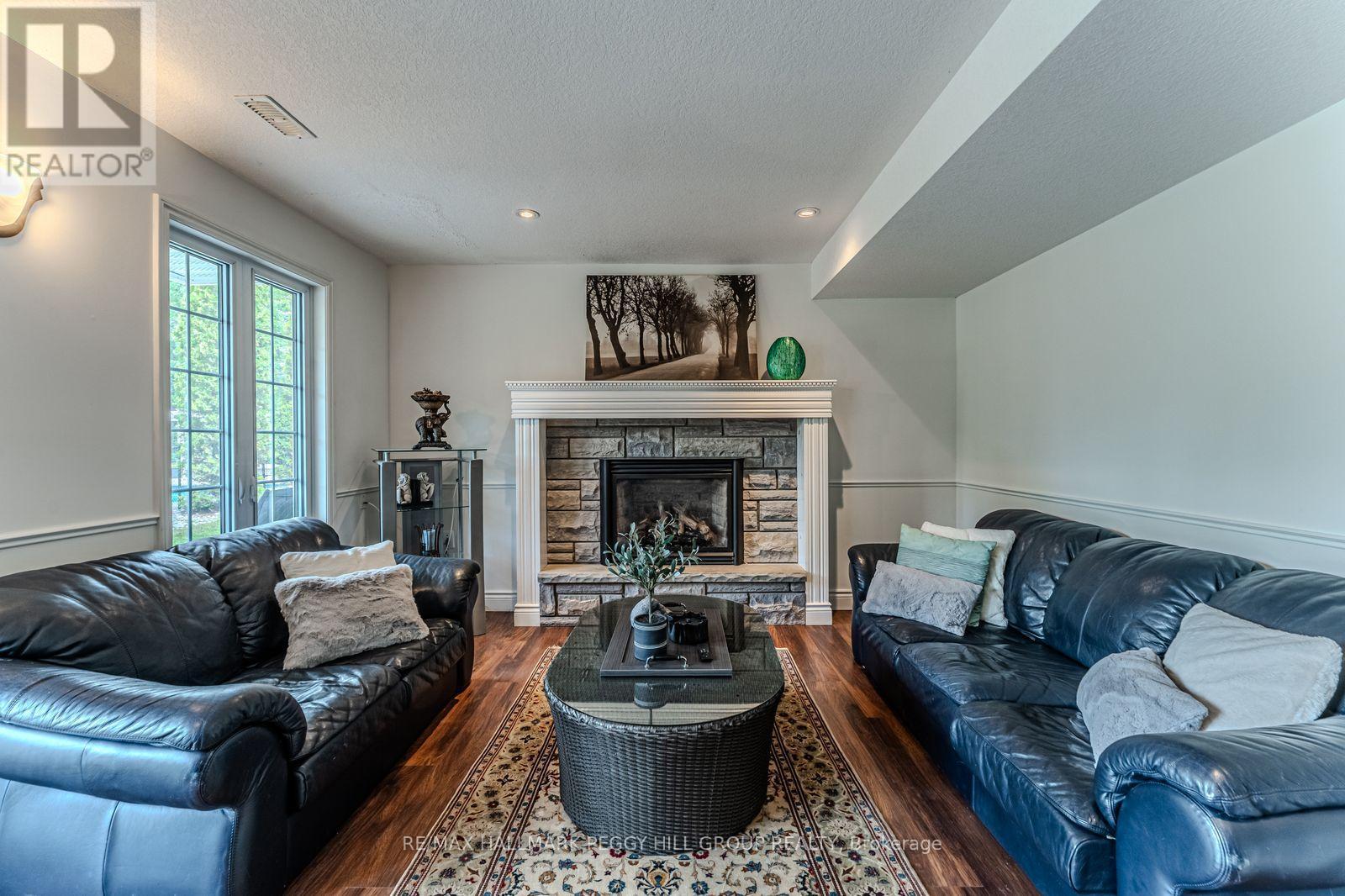 2 Mills Circle, Springwater, ON - Indoor Photo Showing Living Room With Fireplace