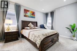 Bedroom featuring light carpet and recessed lighting -