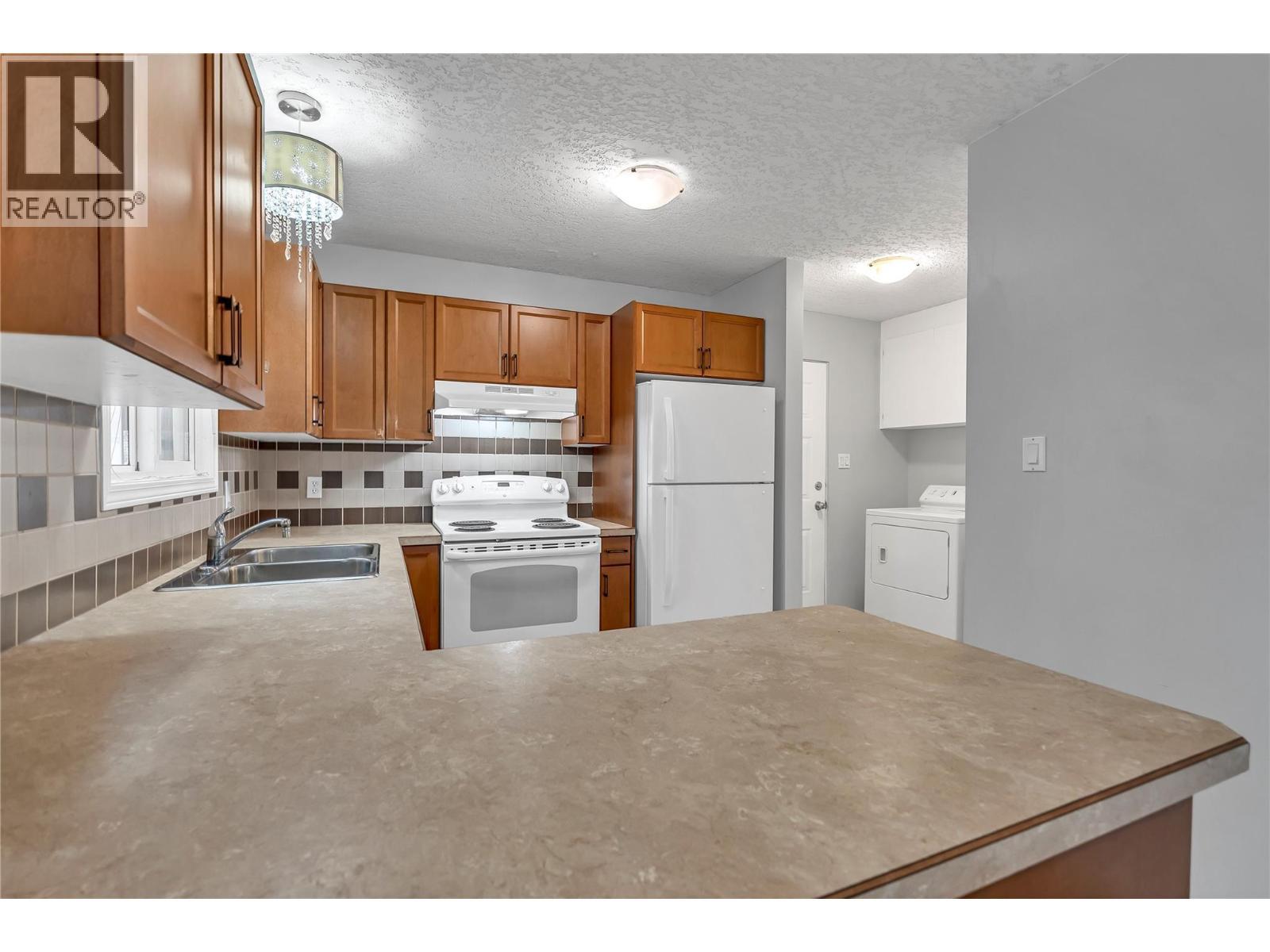 654 Wade Avenue W Unit# 101 & 201, Penticton, BC - Indoor Photo Showing Kitchen With Double Sink